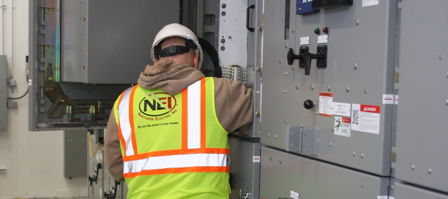 NEI electrician performing electrical maintenance at the Green Bay Metropolitan Sewerage District