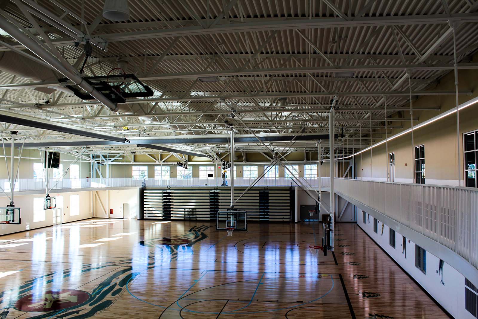 two NCAA regulation-size basketball courts that can be divided into smaller practice areas