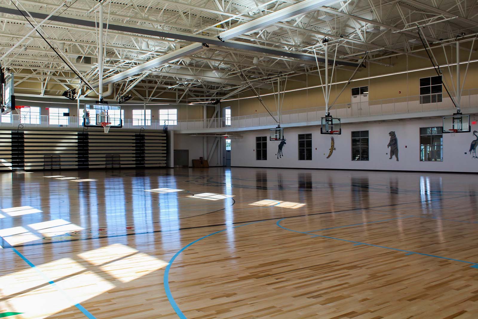 two NCAA regulation-size basketball courts that can be divided into smaller practice areas
