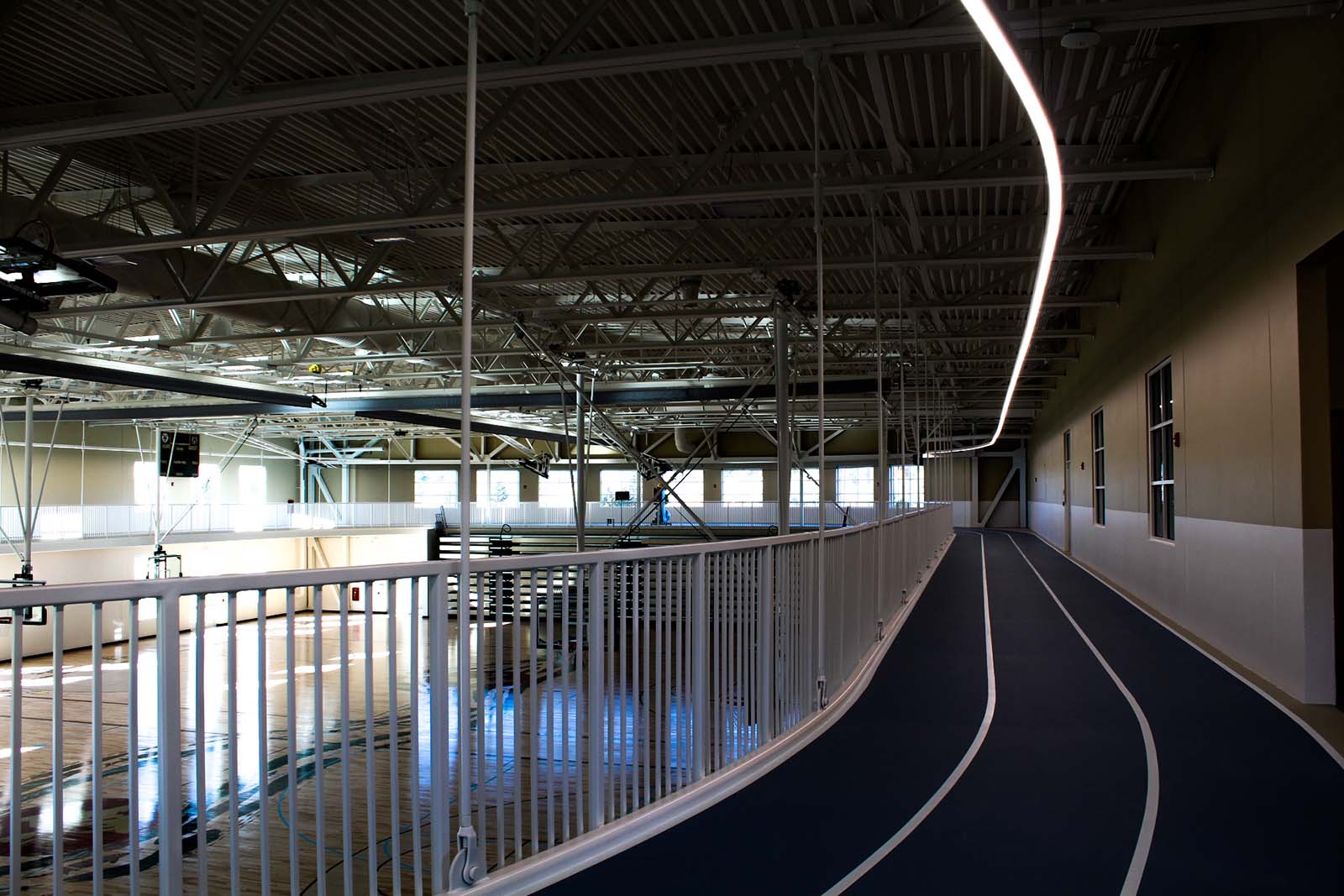 Indoor walking track surrounding two NCAA regulation-size basketball courts
