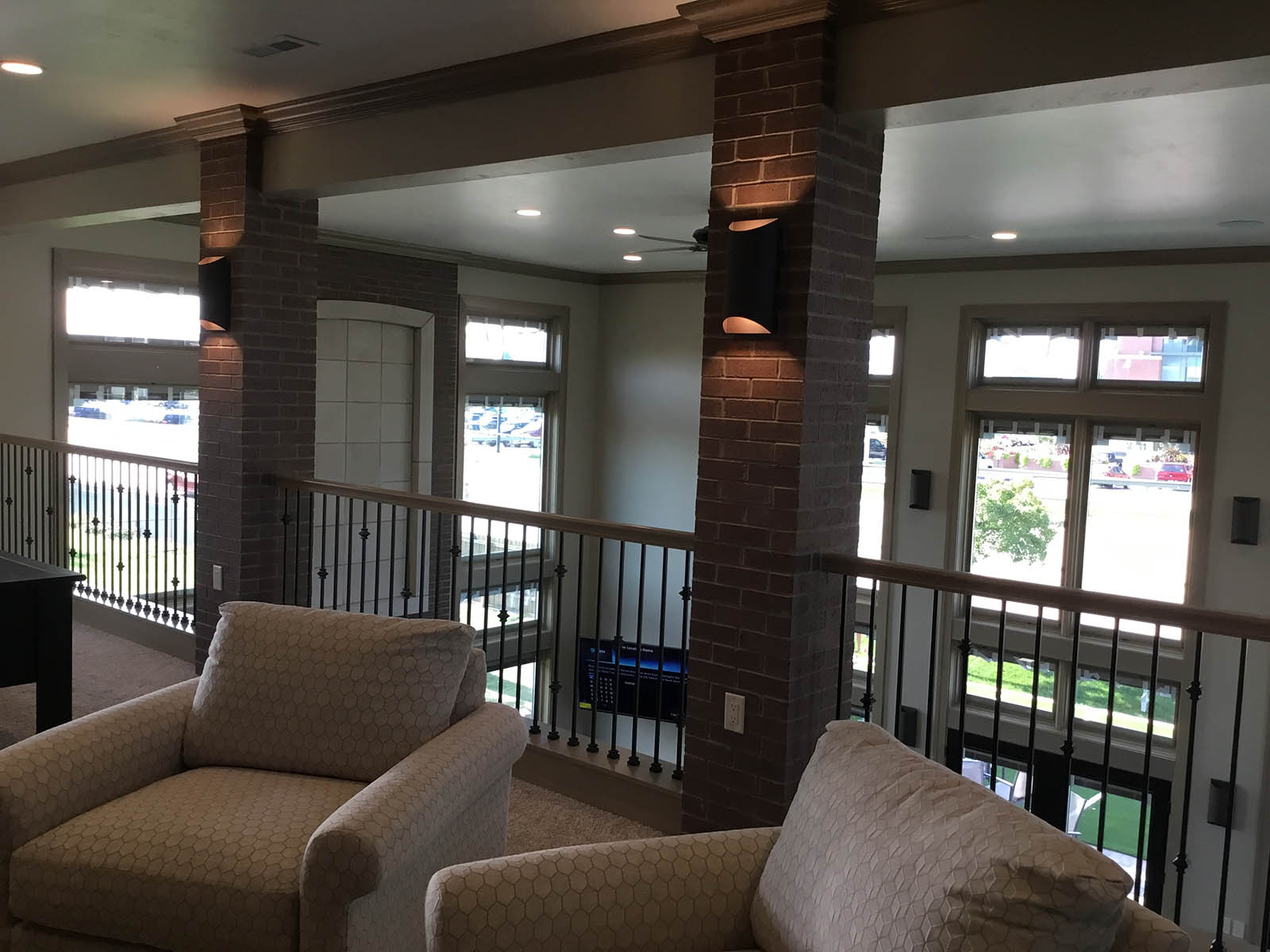 Light fixtures installed on brick pillars