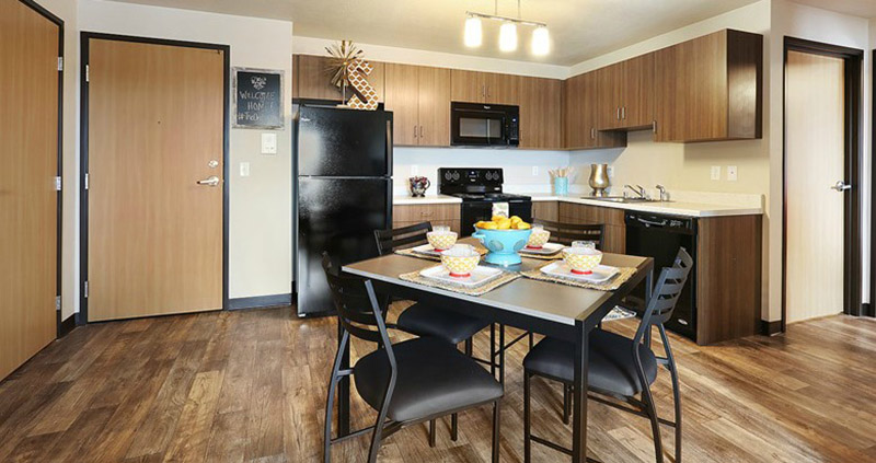 Kitchen with modern amenities and table and chairs for dining