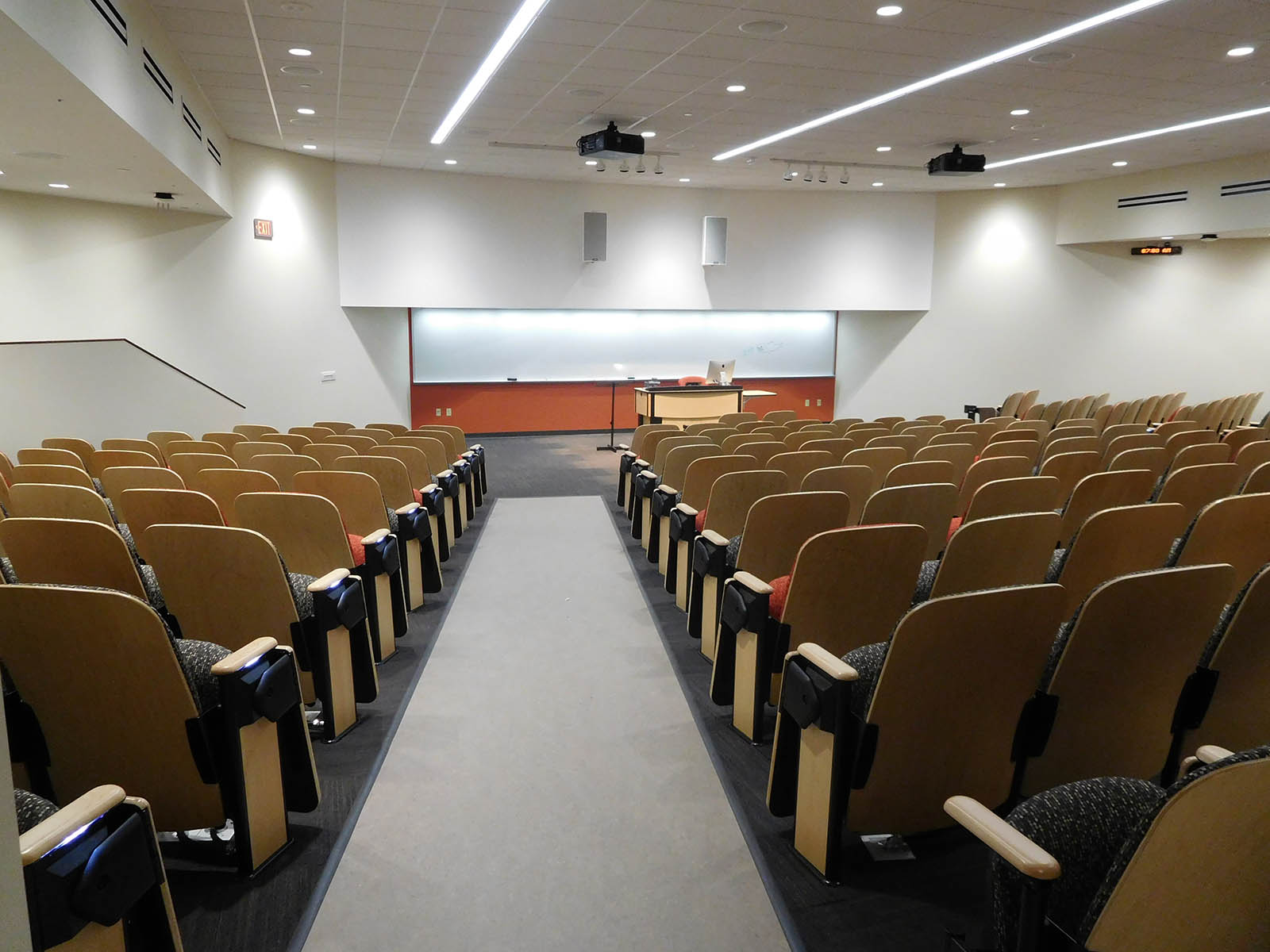 A lecture room at UW Oshkosh with recessed ceiling lights, projectors and audio system